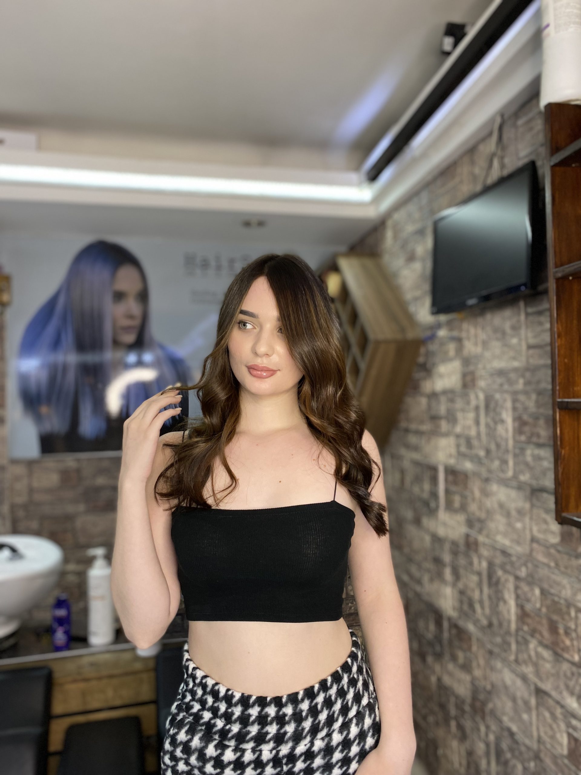 Long brunette layers with soft movement by Ali Akduru